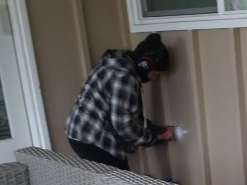 Professional electrician installing an exterior outlet in Oak Grove